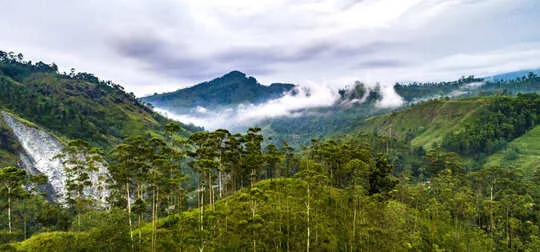Wild monsoon clouds cover the mountain