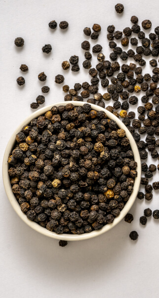 Black pepper in a white bowl 